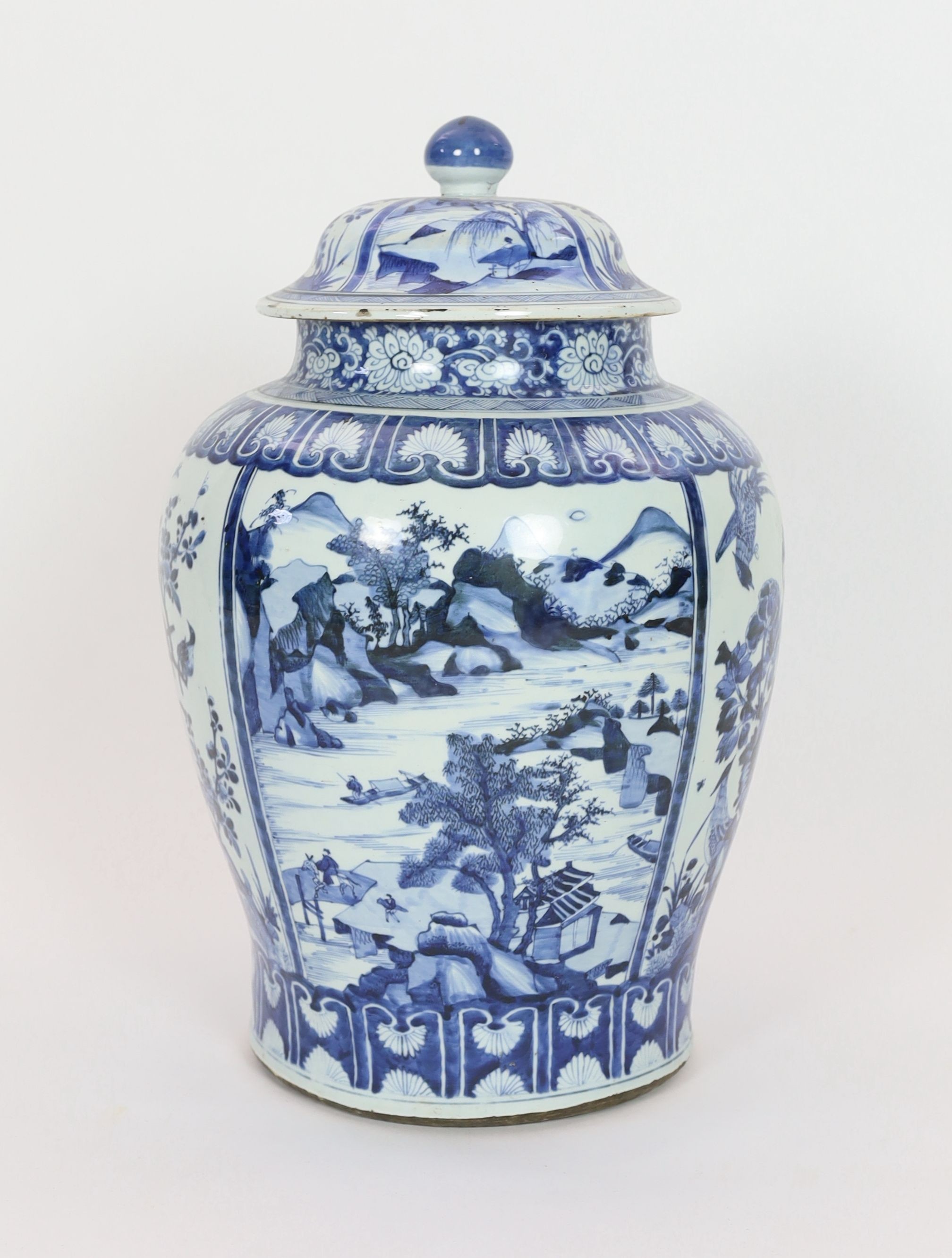 A large Chinese blue and white jar and cover, Kangxi period, 58cm high, Some restored cracks